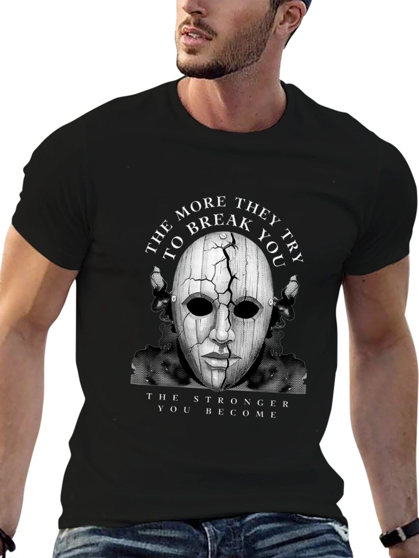 Cracked Mask Graphic T-Shirt - Strength Through Adversity